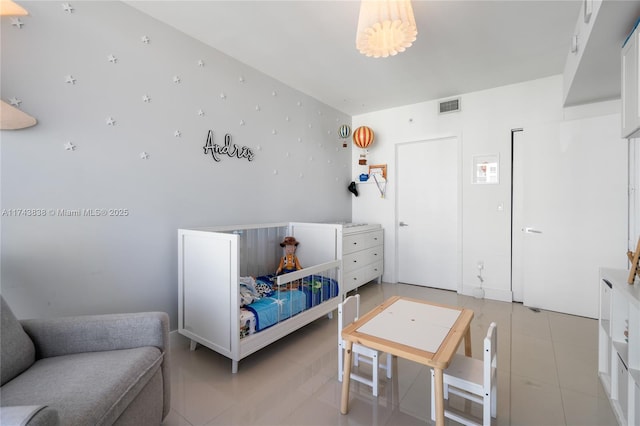 bedroom with light tile patterned flooring