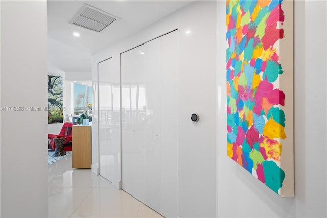 corridor with light tile patterned floors