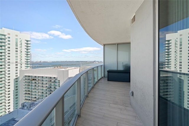 balcony featuring a water view