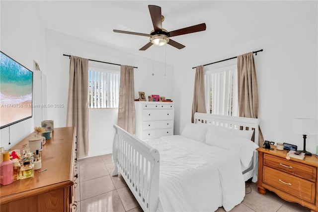 tiled bedroom with ceiling fan