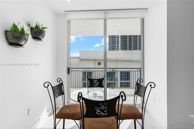 dining area featuring a wall of windows