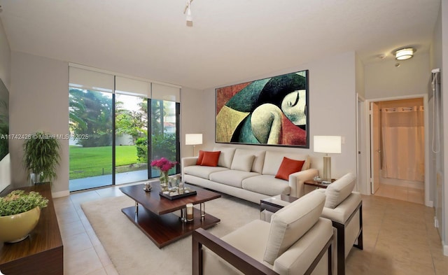 3300 NE 192nd St Unit 111, Aventura, FL 33180 - living area with light tile patterned floors and expansive windows