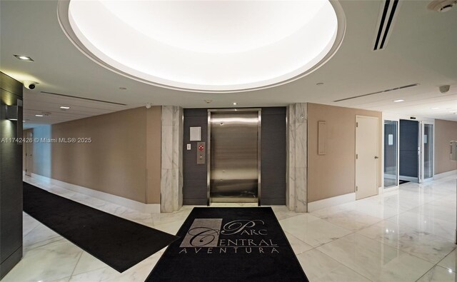 3300 NE 192nd St Unit 111, Aventura, FL 33180 - building lobby featuring a security system and recessed lighting