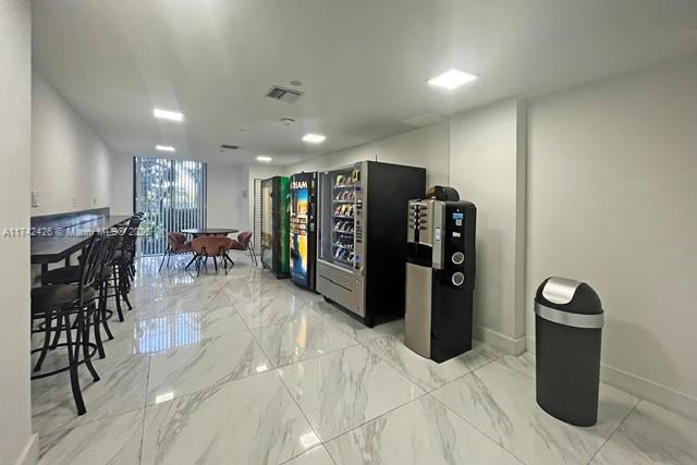 3300 NE 192nd St Unit 111, Aventura, FL 33180 - interior space featuring marble finish floors and baseboards