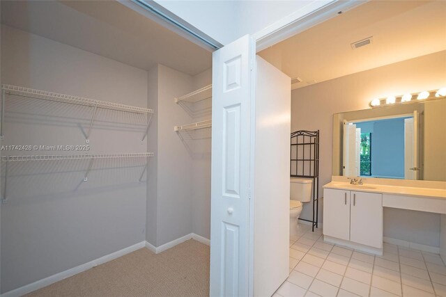 3300 NE 192nd St Unit 111, Aventura, FL 33180 - spacious closet with a sink and light tile patterned flooring