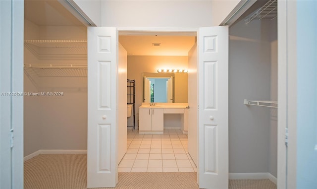 3300 NE 192nd St Unit 111, Aventura, FL 33180 - hall featuring baseboards and light tile patterned floors
