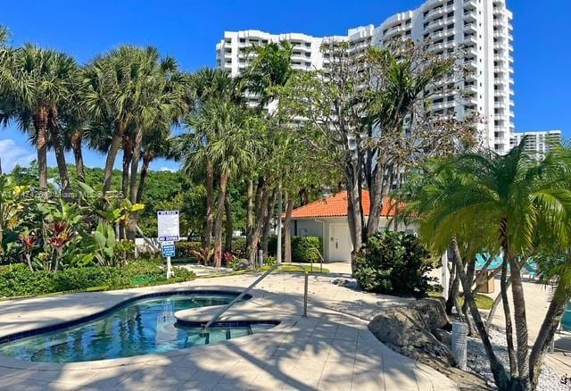 3300 NE 192nd St Unit 111, Aventura, FL 33180 - view of swimming pool featuring a pool and a patio
