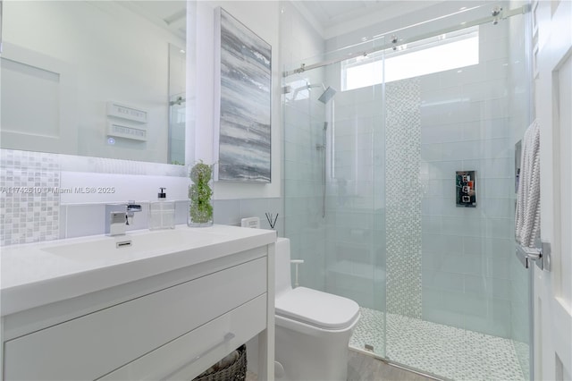 bathroom with tasteful backsplash, vanity, an enclosed shower, and toilet