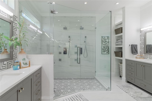 bathroom featuring an enclosed shower, vanity, and ornamental molding