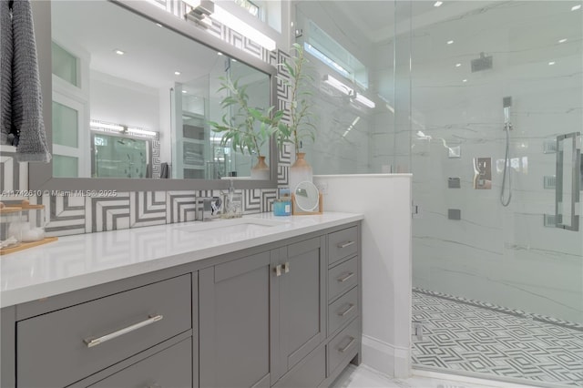 bathroom featuring tasteful backsplash, vanity, ornamental molding, and walk in shower