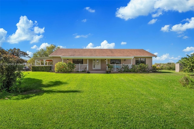 ranch-style home with covered porch and a front yard