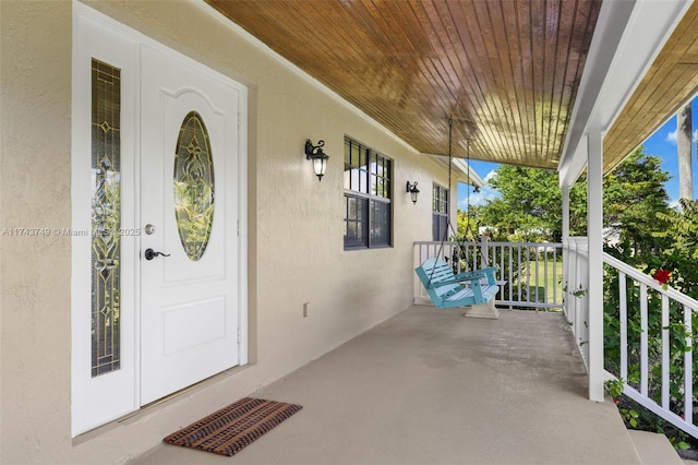 entrance to property with a porch