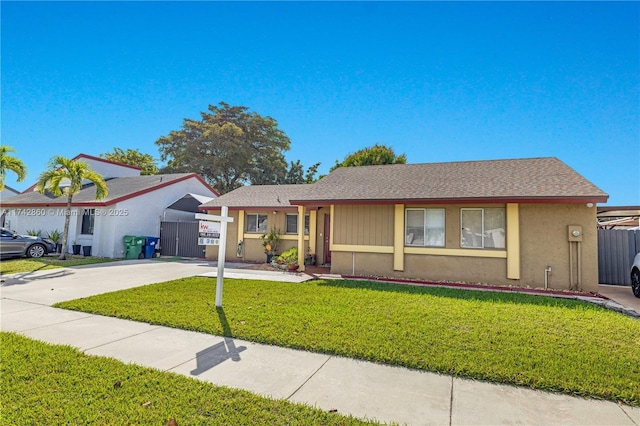 single story home featuring a front yard