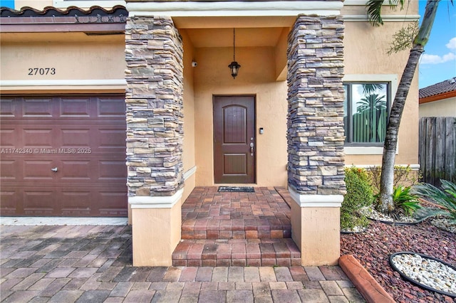 entrance to property featuring a garage