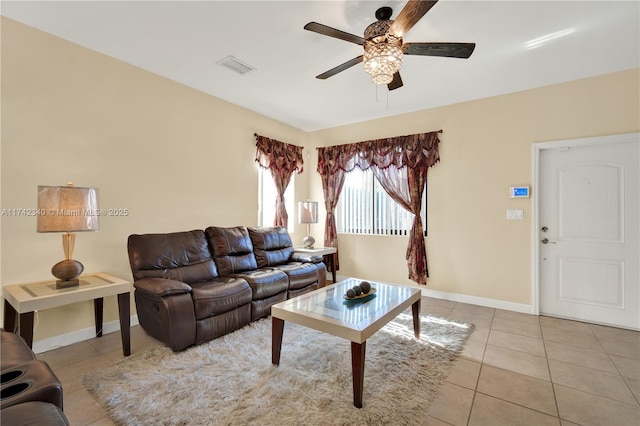 living room featuring light tile patterned flooring and ceiling fan