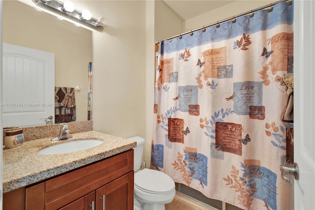 bathroom featuring vanity, curtained shower, and toilet