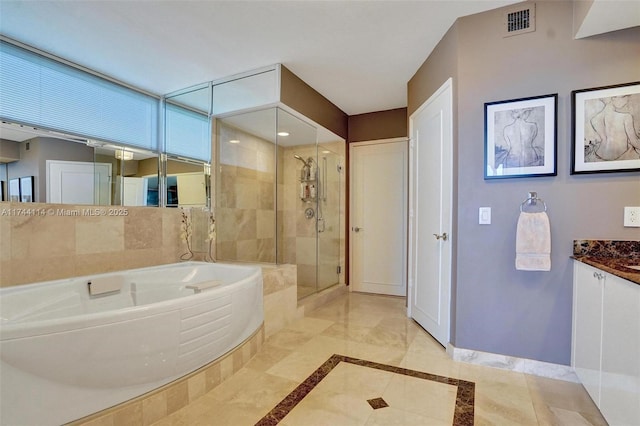 bathroom featuring vanity and plus walk in shower