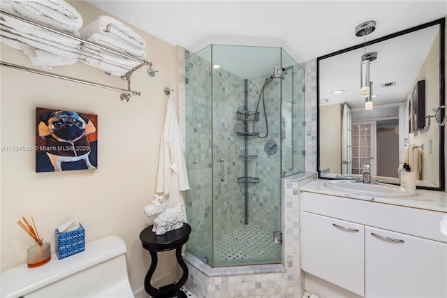 2555 Collins Ave Unit 607, Miami Beach, FL 33140 - bathroom with a stall shower, vanity, and toilet