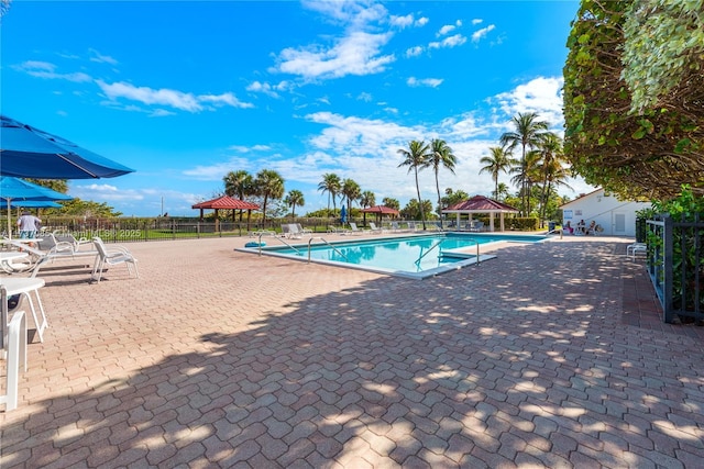 2555 Collins Ave Unit 607, Miami Beach, FL 33140 - community pool with a gazebo and a patio area