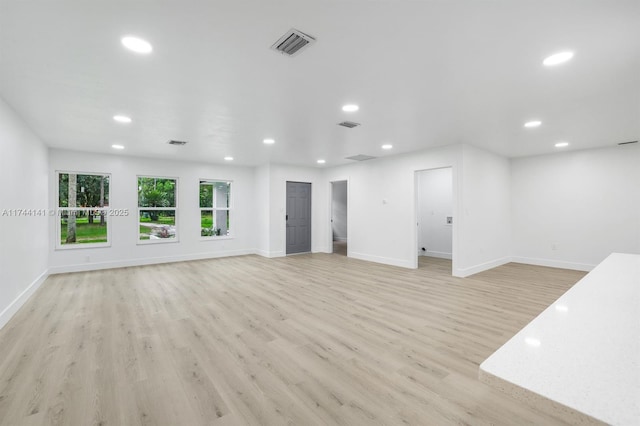 unfurnished living room with light hardwood / wood-style flooring