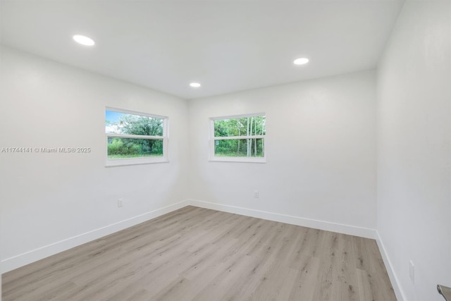 spare room with light hardwood / wood-style floors