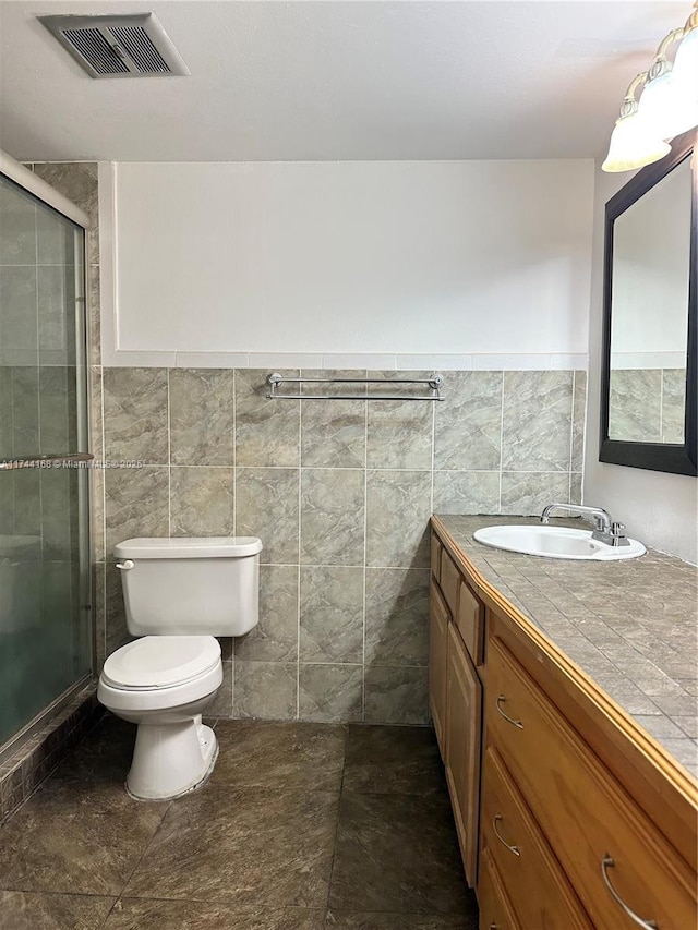 1750 NE 191st St Unit 225-4, Miami, FL 33179 - bathroom with walk in shower, tile walls, vanity, and toilet