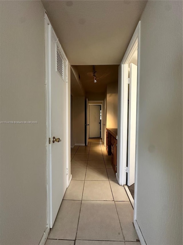 1750 NE 191st St Unit 225-4, Miami, FL 33179 - corridor with light tile patterned floors