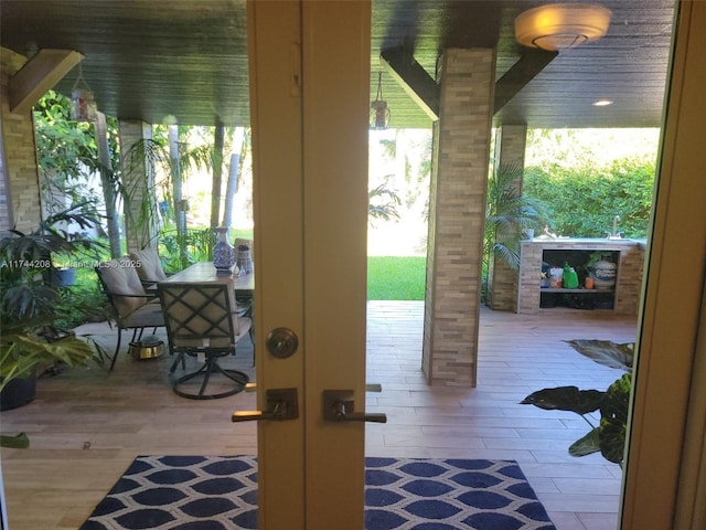 doorway to outside with hardwood / wood-style flooring, plenty of natural light, and french doors