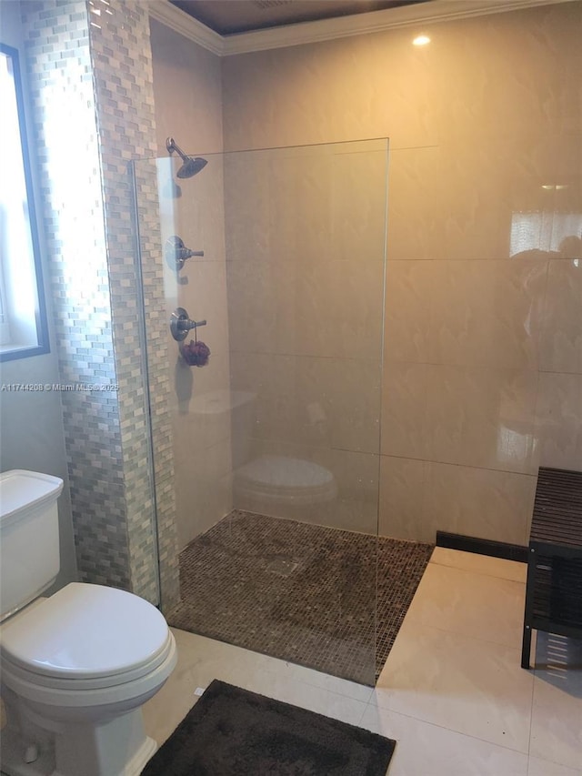 bathroom featuring tile walls, ornamental molding, toilet, and tiled shower