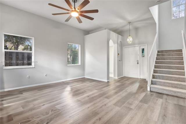 7459 NW 17th Dr, Pembroke Pines, FL 33024 - foyer with a ceiling fan, arched walkways, stairs, and wood finished floors