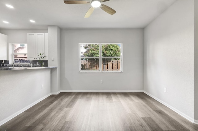 7459 NW 17th Dr, Pembroke Pines, FL 33024 - unfurnished living room with plenty of natural light, wood finished floors, ceiling fan, and recessed lighting