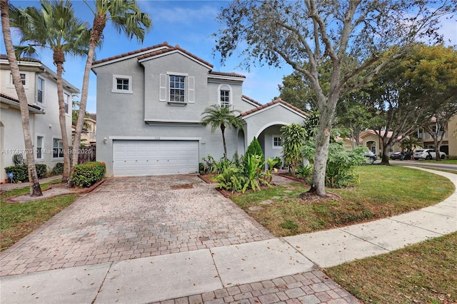 7459 NW 17th Dr, Pembroke Pines, FL 33024 - mediterranean / spanish home featuring stucco siding, decorative driveway, an attached garage, and a tiled roof