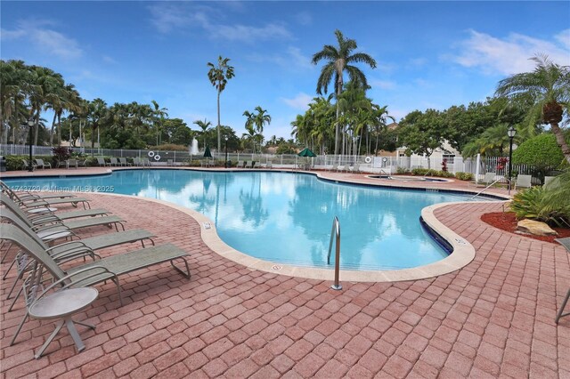 7459 NW 17th Dr, Pembroke Pines, FL 33024 - community pool featuring a patio