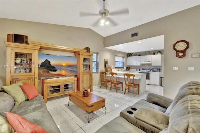 tiled living room featuring lofted ceiling and ceiling fan