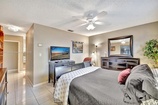 5911 Epsom Ln, Davie, FL 33331 - bedroom with light tile patterned floors, a textured ceiling, baseboards, and ceiling fan