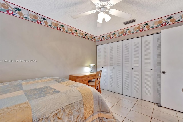 5911 Epsom Ln, Davie, FL 33331 - bedroom featuring light tile patterned floors, a closet, a textured ceiling, and ceiling fan