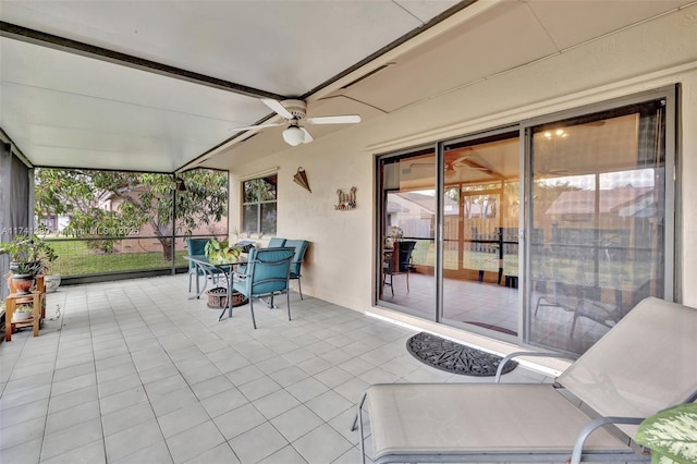 sunroom with ceiling fan and a healthy amount of sunlight