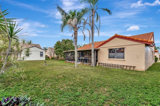 view of yard with a sunroom