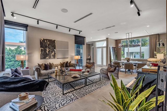 285 W Mashta Dr, Key Biscayne, FL 33149 - living room featuring rail lighting, healthy amount of natural light, a chandelier, and recessed lighting