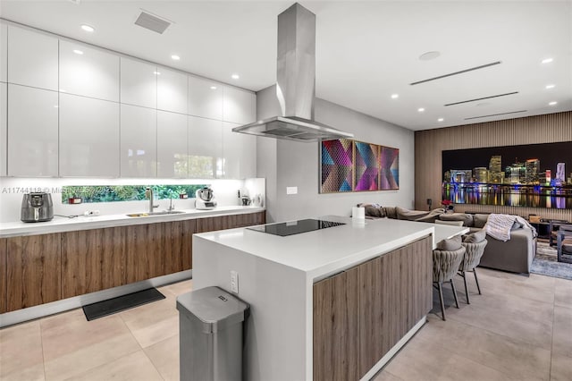 285 W Mashta Dr, Key Biscayne, FL 33149 - kitchen with island range hood, modern cabinets, black electric cooktop, open floor plan, and recessed lighting