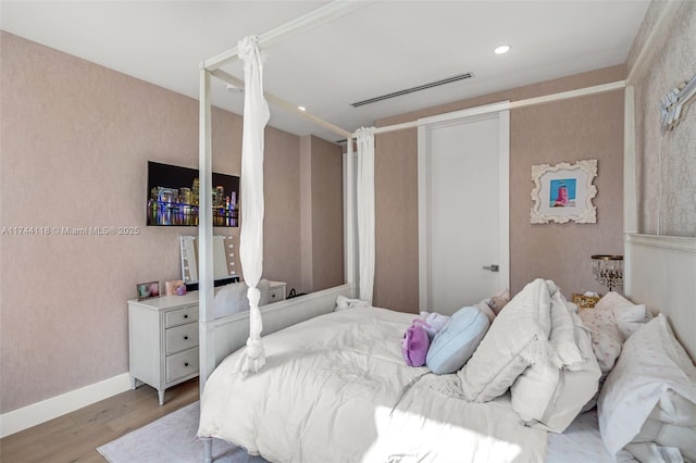 285 W Mashta Dr, Key Biscayne, FL 33149 - bedroom featuring wood finished floors and baseboards