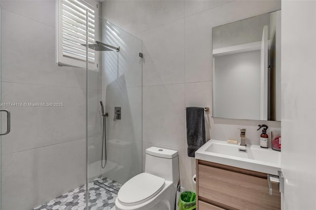 285 W Mashta Dr, Key Biscayne, FL 33149 - full bathroom featuring tile walls, vanity, a shower stall, and toilet