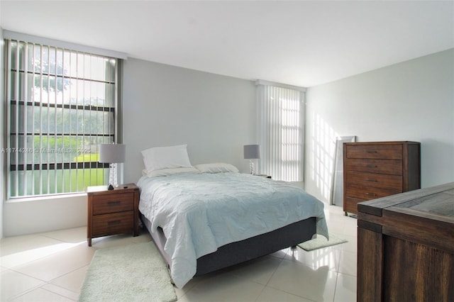 bedroom with light tile patterned floors