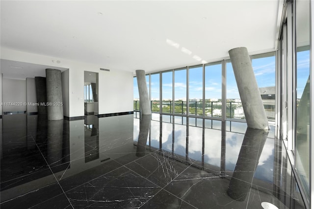 empty room featuring floor to ceiling windows