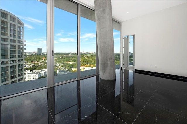 entryway with floor to ceiling windows