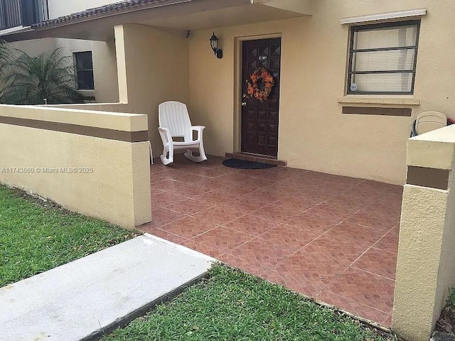 doorway to property featuring a patio