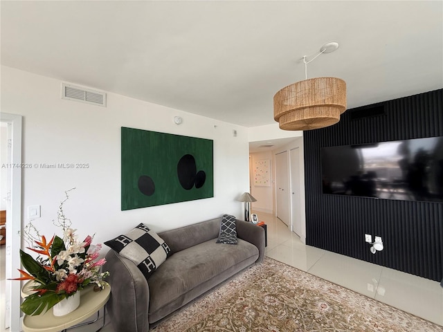 living room with visible vents and tile patterned floors