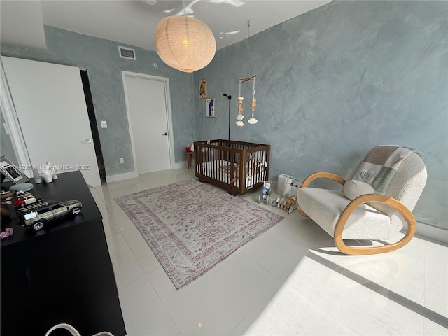 bedroom featuring tile patterned flooring and visible vents