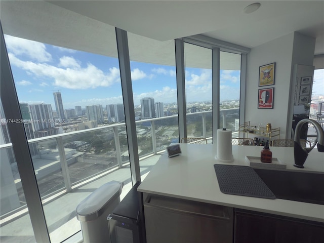 interior space featuring a wall of windows and a view of city