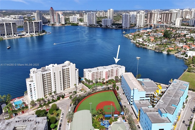 birds eye view of property with a water view